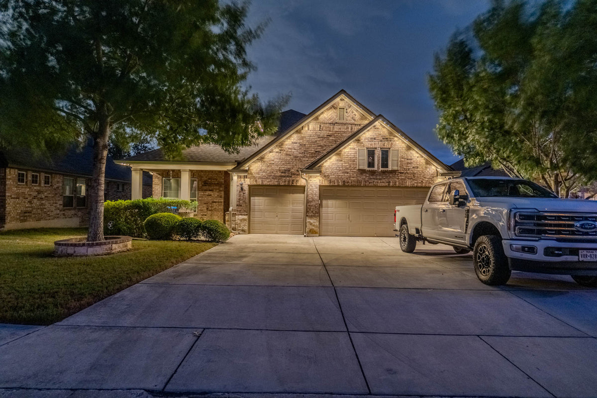 Architectural permanent lighting across a modern roofline
