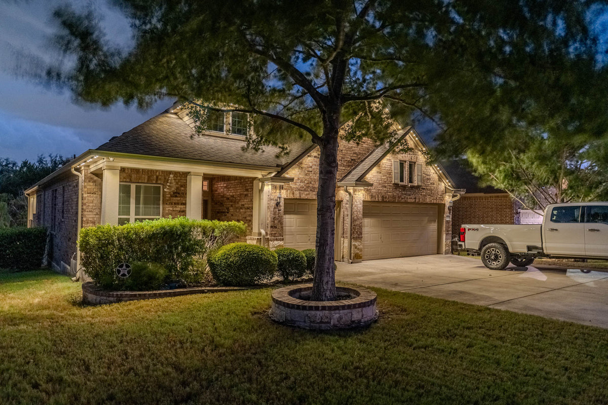 Warm white permanent lighting highlighting a residential exterior