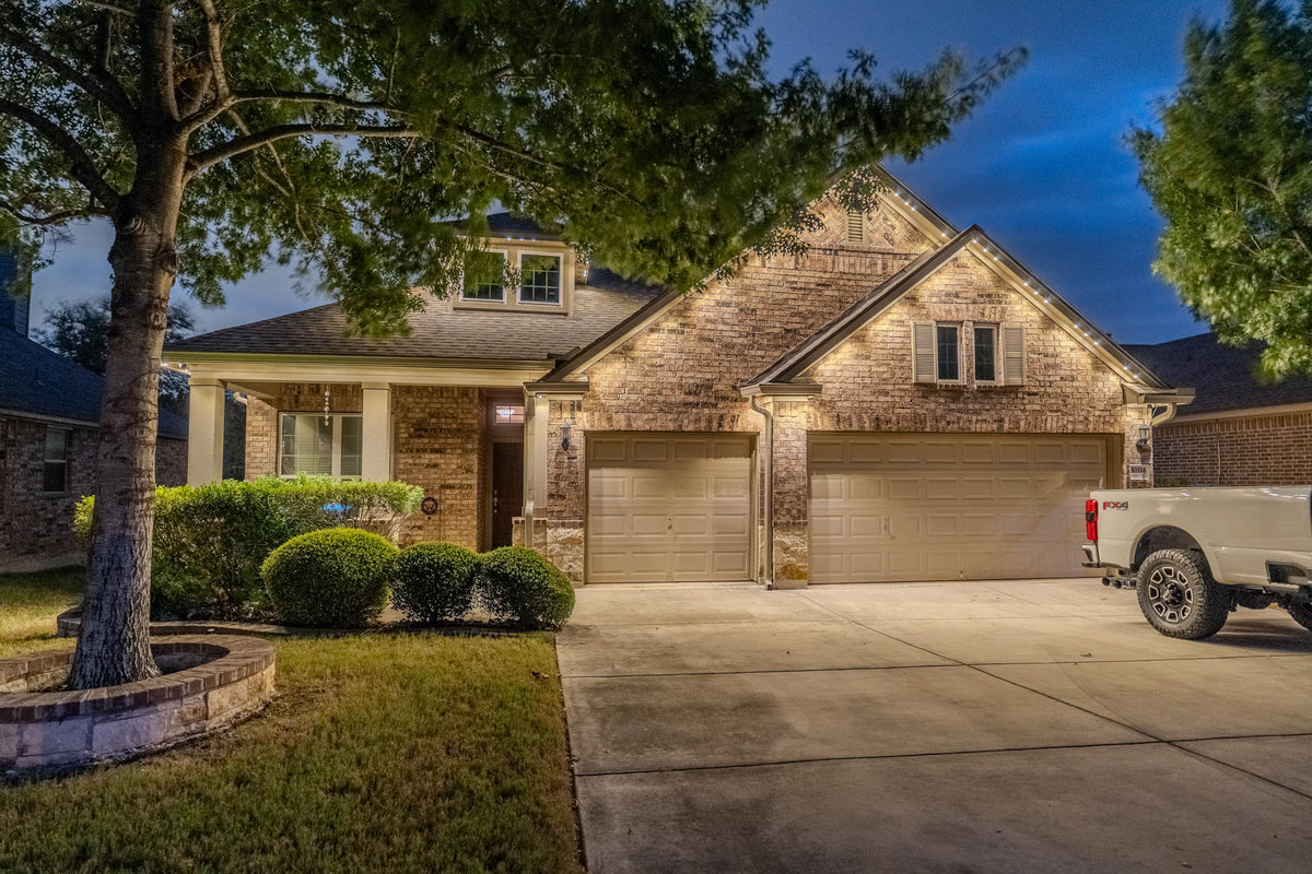 Permanent lighting outlining a distinctive home after dark
