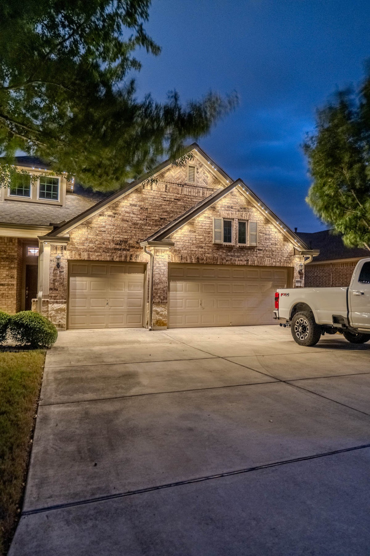 A considered warm lighting scene for an elegant exterior