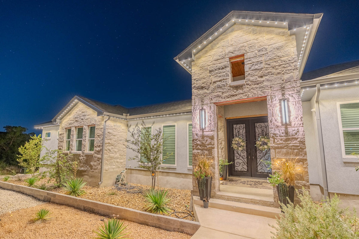 Warm architectural lighting framing a residential entry