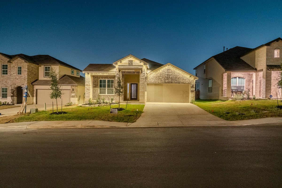 Warm architectural lighting across a residential roofline