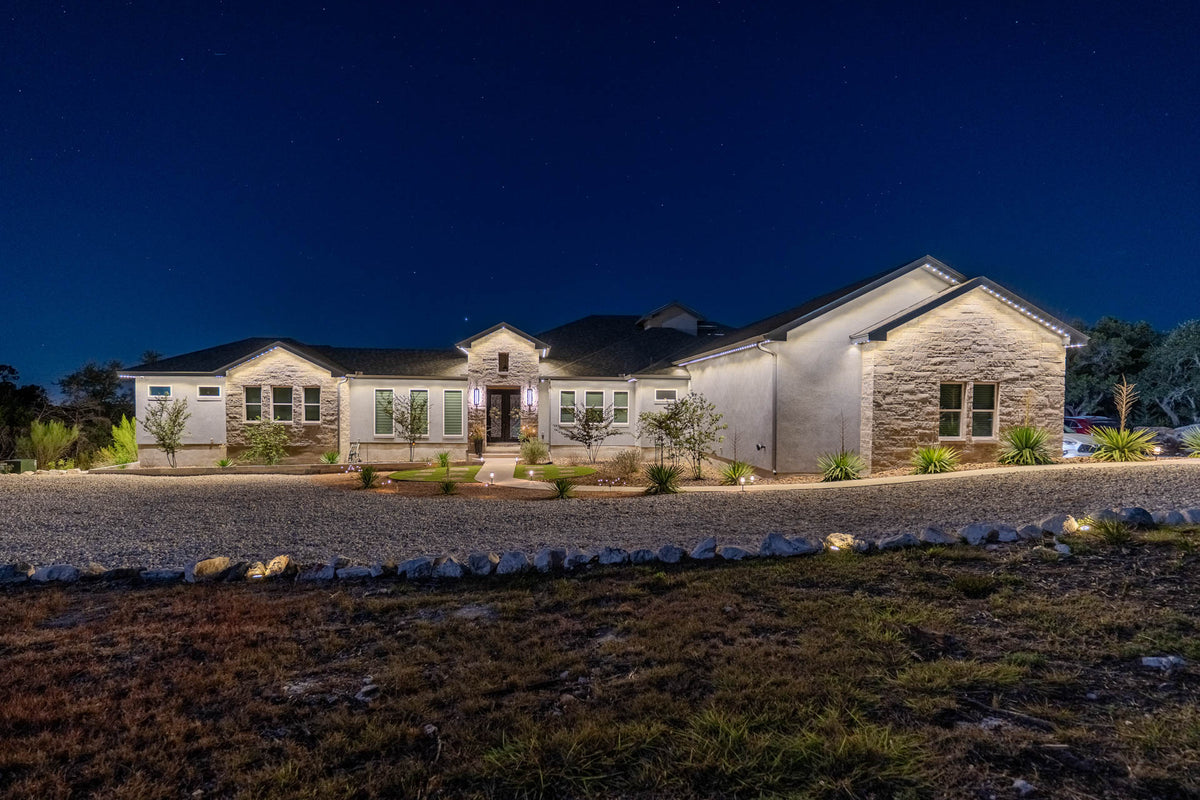 Permanent lighting across a wide residential roofline