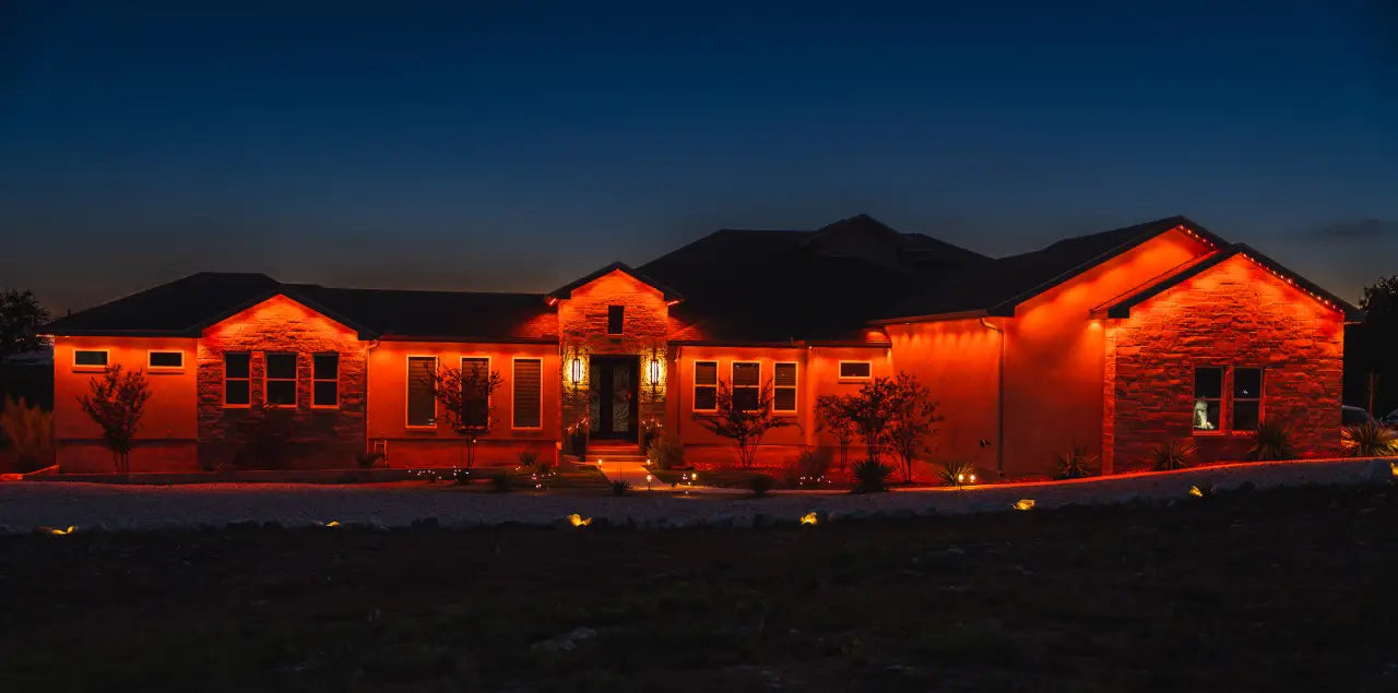 Home illuminated with warm white architectural lighting