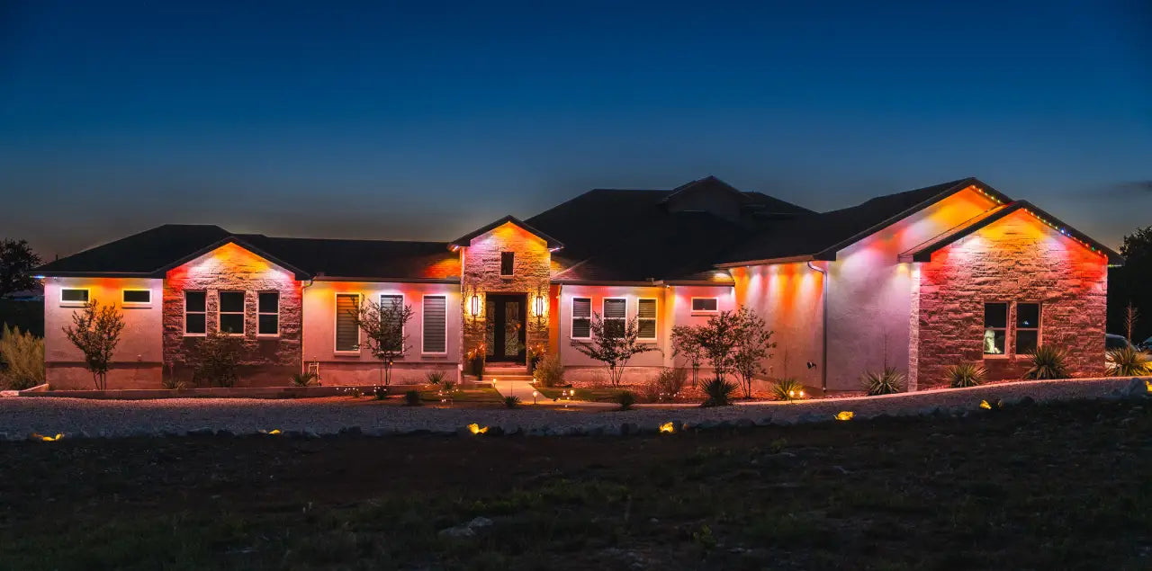 Home illuminated with a colorful holiday lighting scene